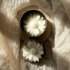 Daisy Bloom Candle in tin jar with rose and vanilla fragrance