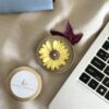 Close-up of a Daisy Bloom candle burning evenly with a 100% cotton wick for a clean flame.