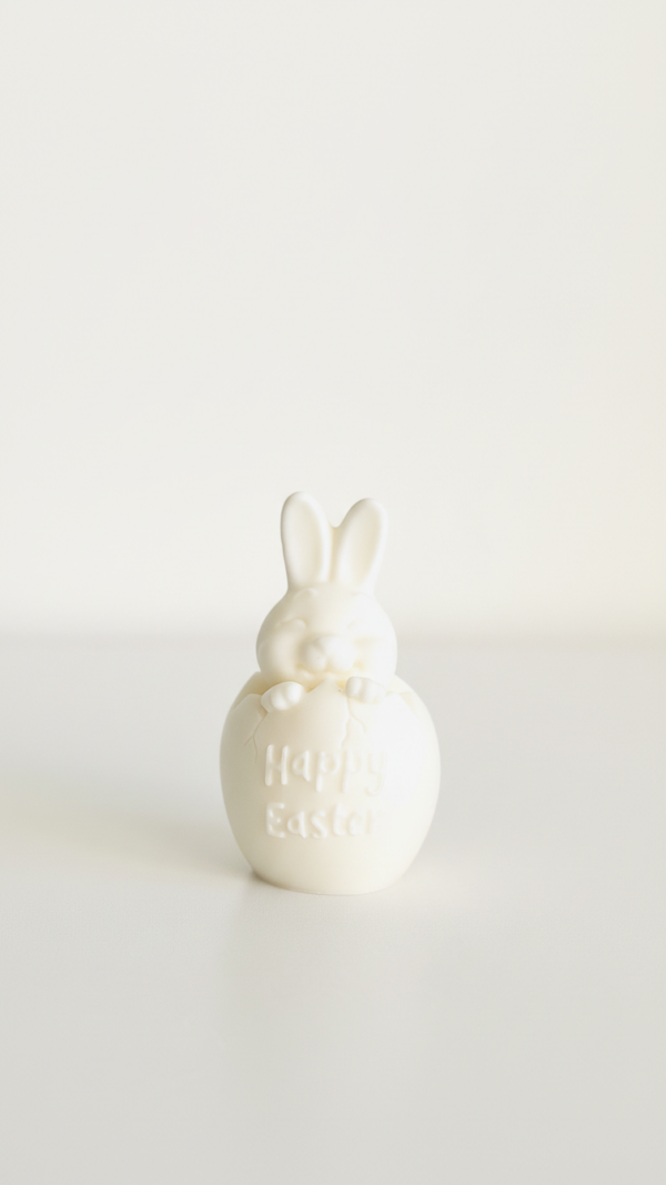 Detailed view of a hand-poured sculptural Easter egg and bunny candle set made from premium Australian soy wax