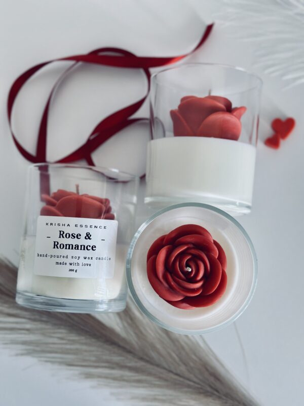 Rose & Romance Candle in glass jar with wax rose top and rose vanilla fragrance