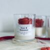 Rose & Romance Candle in glass jar with wax rose top and rose vanilla fragrance