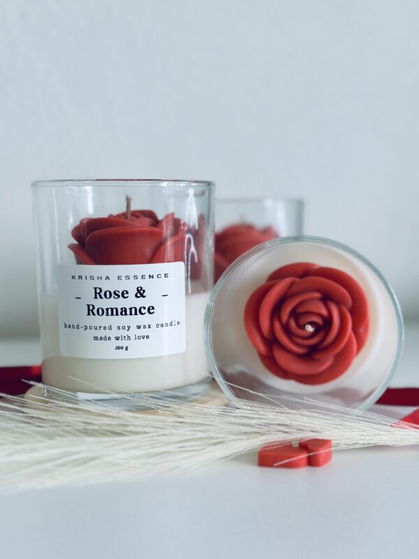 Rose & Romance Candle in glass jar with wax rose top and rose vanilla fragrance