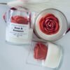 Rose & Romance Candle in glass jar with wax rose top and rose vanilla fragrance