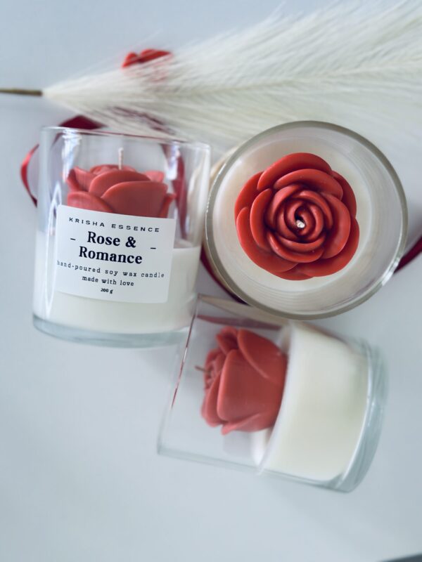 Rose & Romance Candle in glass jar with wax rose top and rose vanilla fragrance