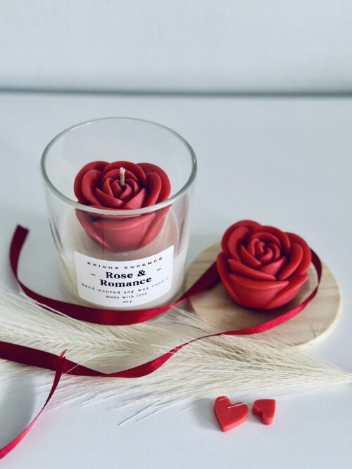Rose & Romance Candle in glass jar with wax rose top and rose vanilla fragrance