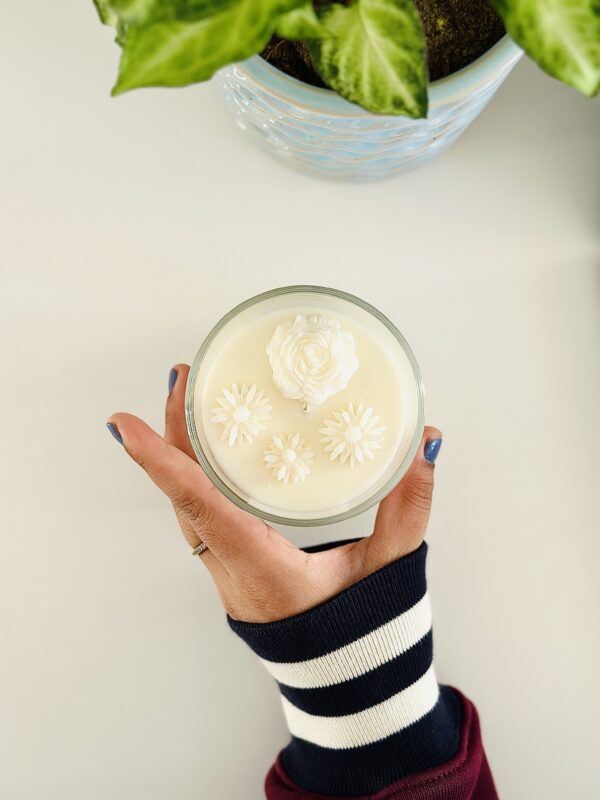 Hand-poured floral soy candle in Perth featuring a handcrafted wax peony and three small daisies on top.