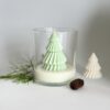 Whisper of Pine handmade soy wax candle with pine decorations in clear glass jar