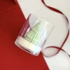 Pine tree scented candle, Whisper of Pine sculpted soy candle with festive red backdrop