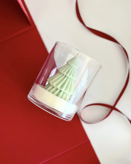 Pine tree scented candle, Whisper of Pine sculpted soy candle with festive red backdrop
