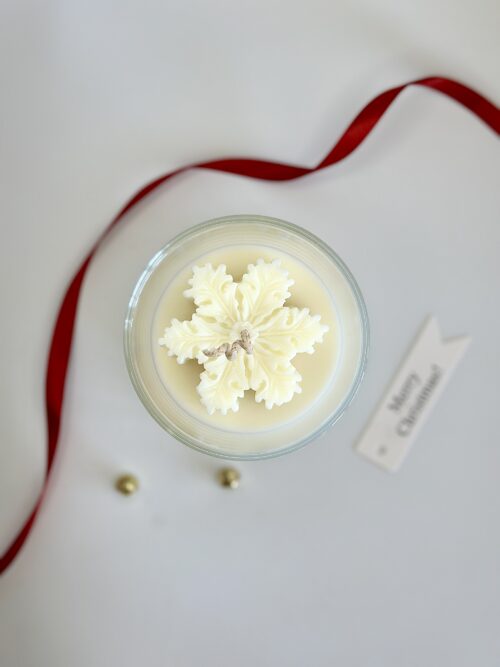 Snowflake-topped Christmas soy candle Australia photographed for holiday collection.
