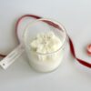 Handmade Christmas soy candle Australia with snowflake design in clear glass jar.