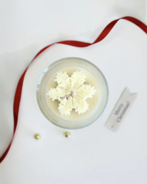 Snowflake christmas candle top view, hand-molded soy wax snowflake with festive ribbon