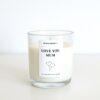 A minimalist 'Love You Mum' glass jar candle styled on a table representing the ultimate relaxation gift for her