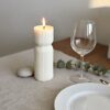 Unique Mother's Day gifts styled on a dining table; an ivory sculptural pillar candle creating a modern minimalist home decor aesthetic in a Perth home.