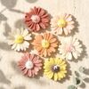Bulk mini daisy soy candle favours Australia — sculptural wax daisy event candle pack wedding baby shower Perth Krisha Essence