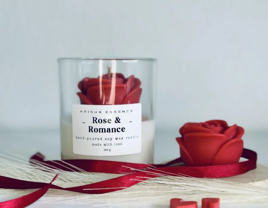 Rose & Romance Candle in glass jar with wax rose top and rose vanilla fragrance